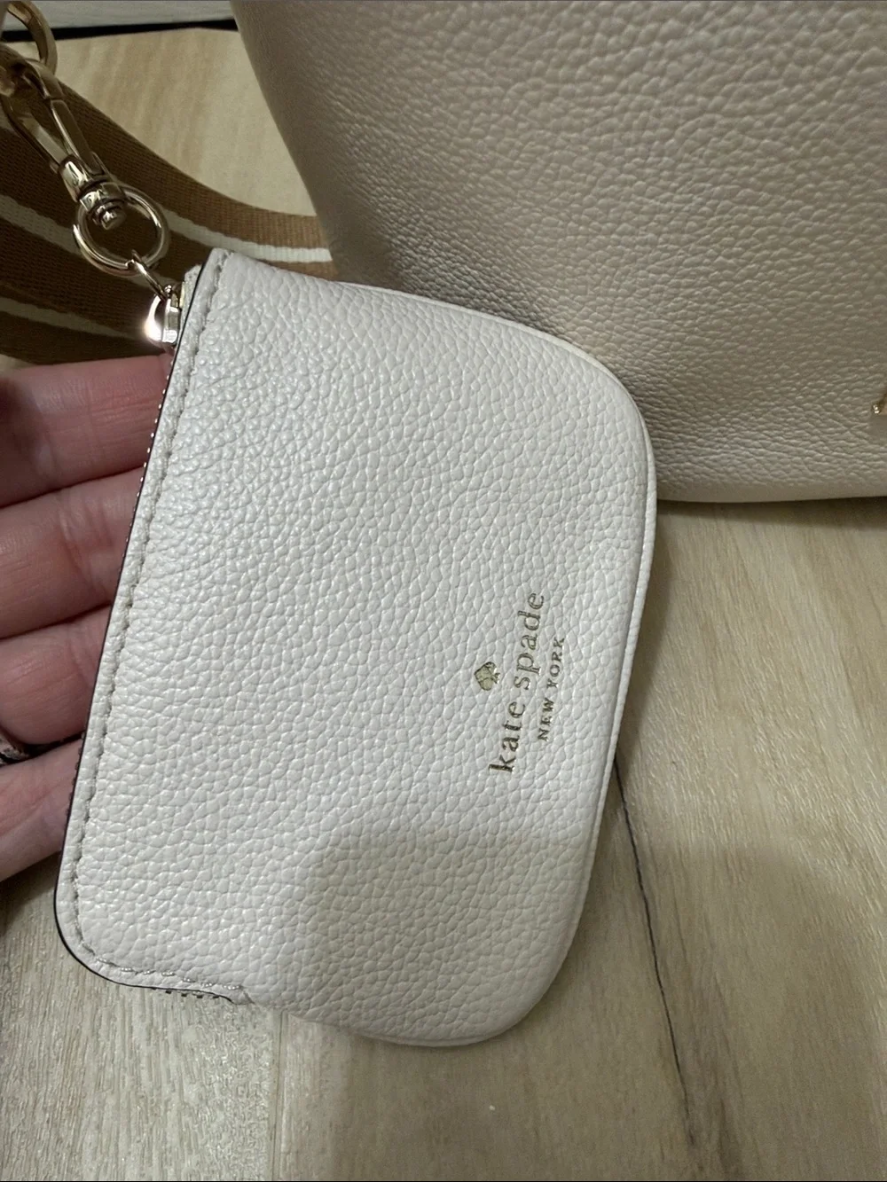 kate spade cream pebble leather drawstring bucket bag with striped tan strap